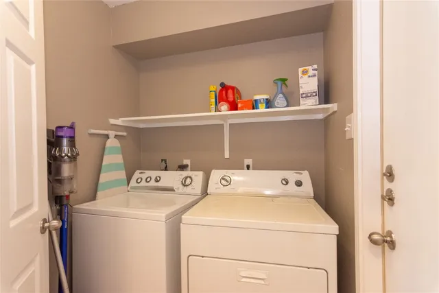 a utility room with dryer and washer
