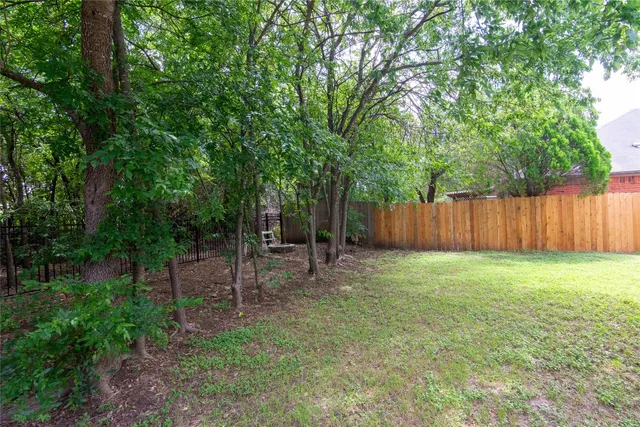 a backyard of a house with lots of green space