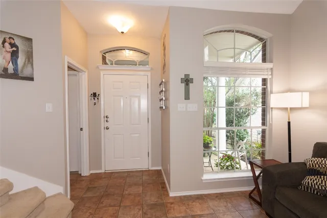 a view of a livingroom with furniture and a window