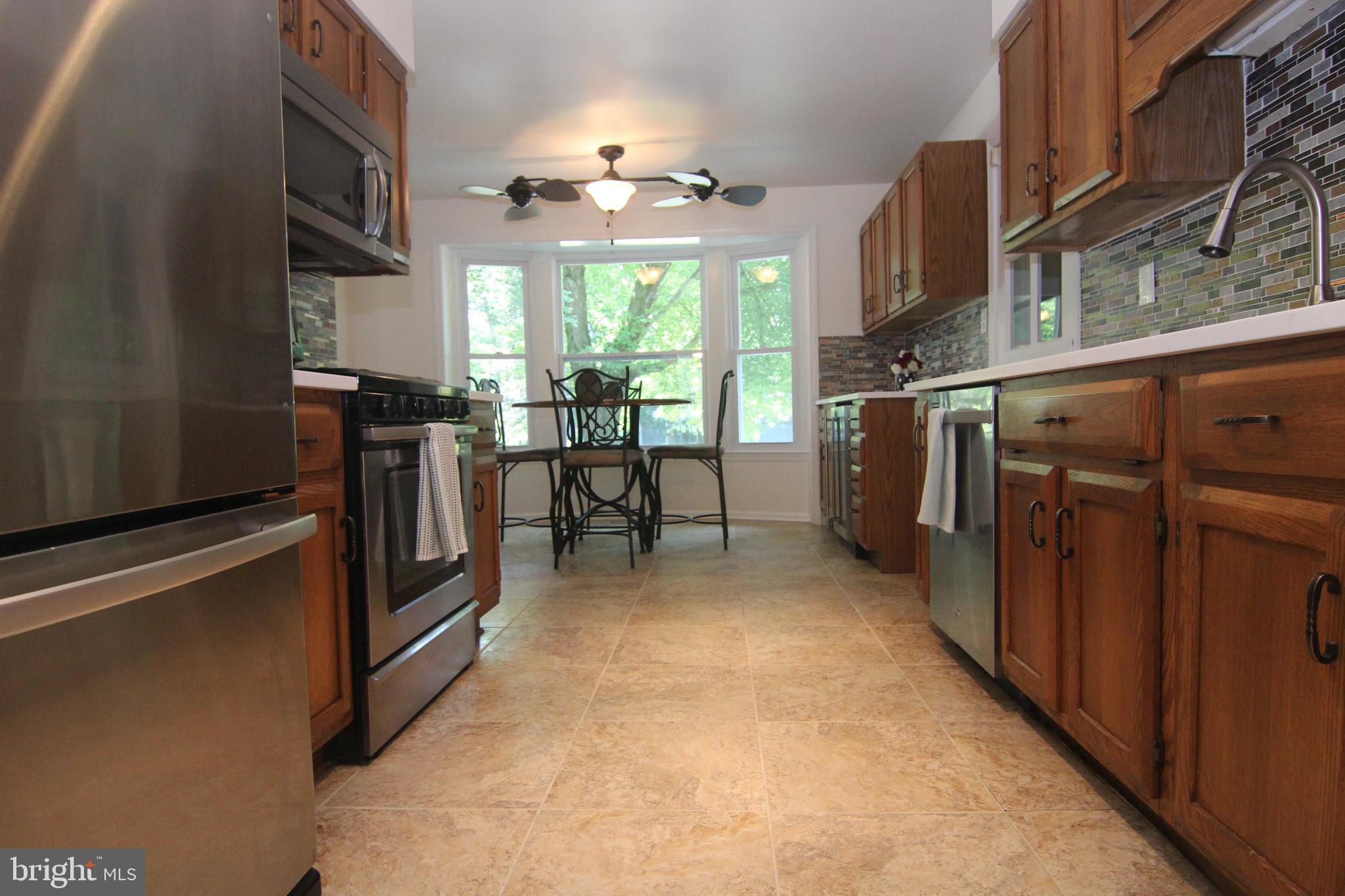 14115 Ansted Road Silver Spring, MD 20905 - Photo 8 of 42 2019 Remodeled Kitchen. Granite, Stainless Steel..