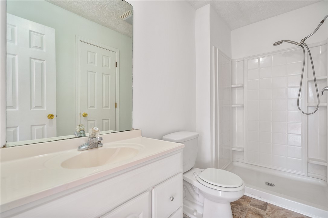 2305 Millgate Road Anderson, SC 29621 - Photo 12 of 18 Functional full bathroom featuring a convenient shower and a vanity with an integrated sink.