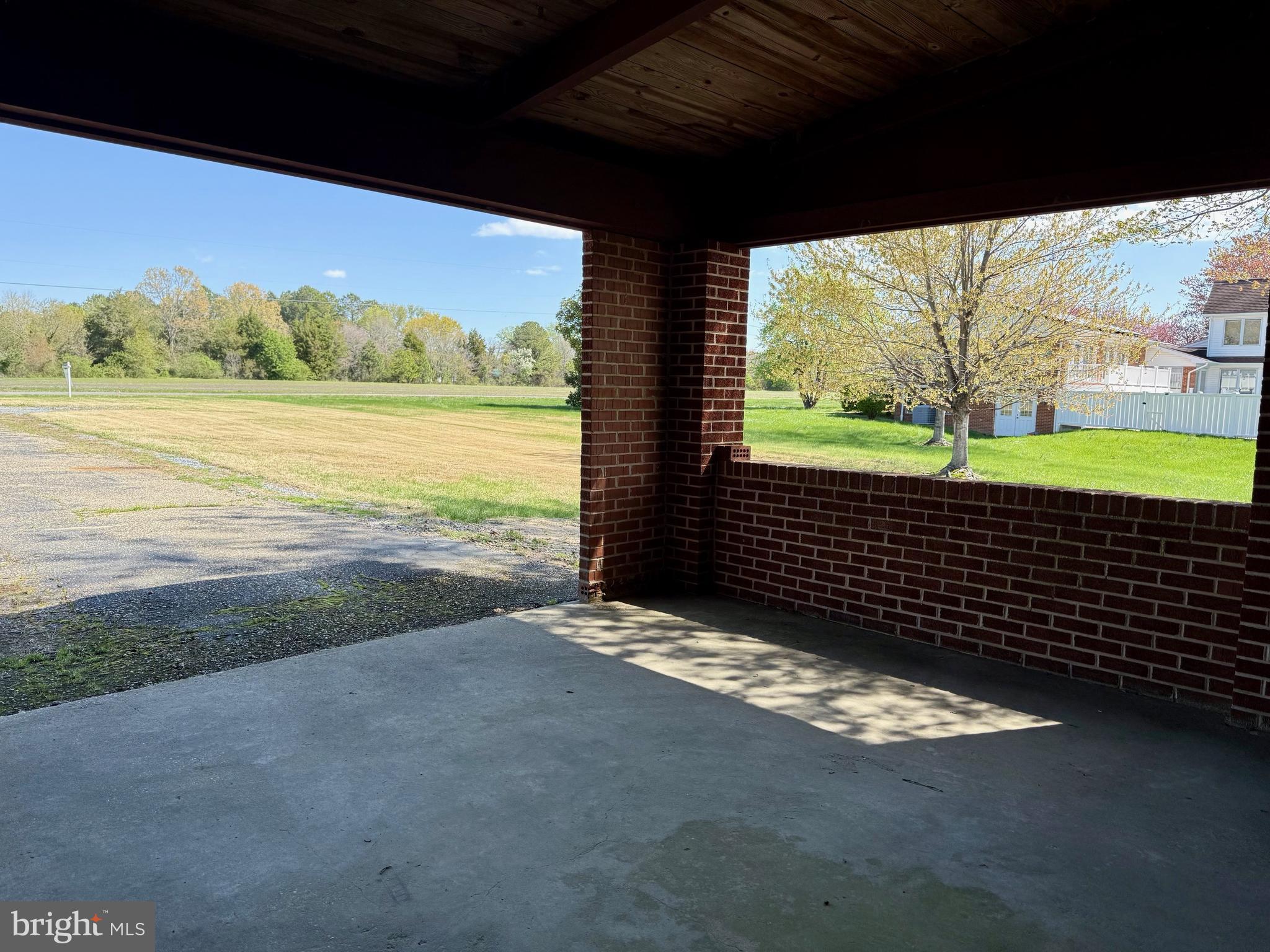 48607 Deep Cove Lane Ridge, MD 20680 - Photo 36 of 47 a view of a floor to ceiling window next to a yard