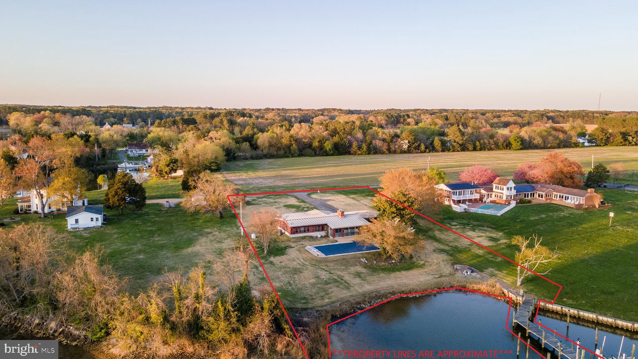 48607 Deep Cove Lane Ridge, MD 20680 - Photo 5 of 47 an aerial view of a house with a lake view