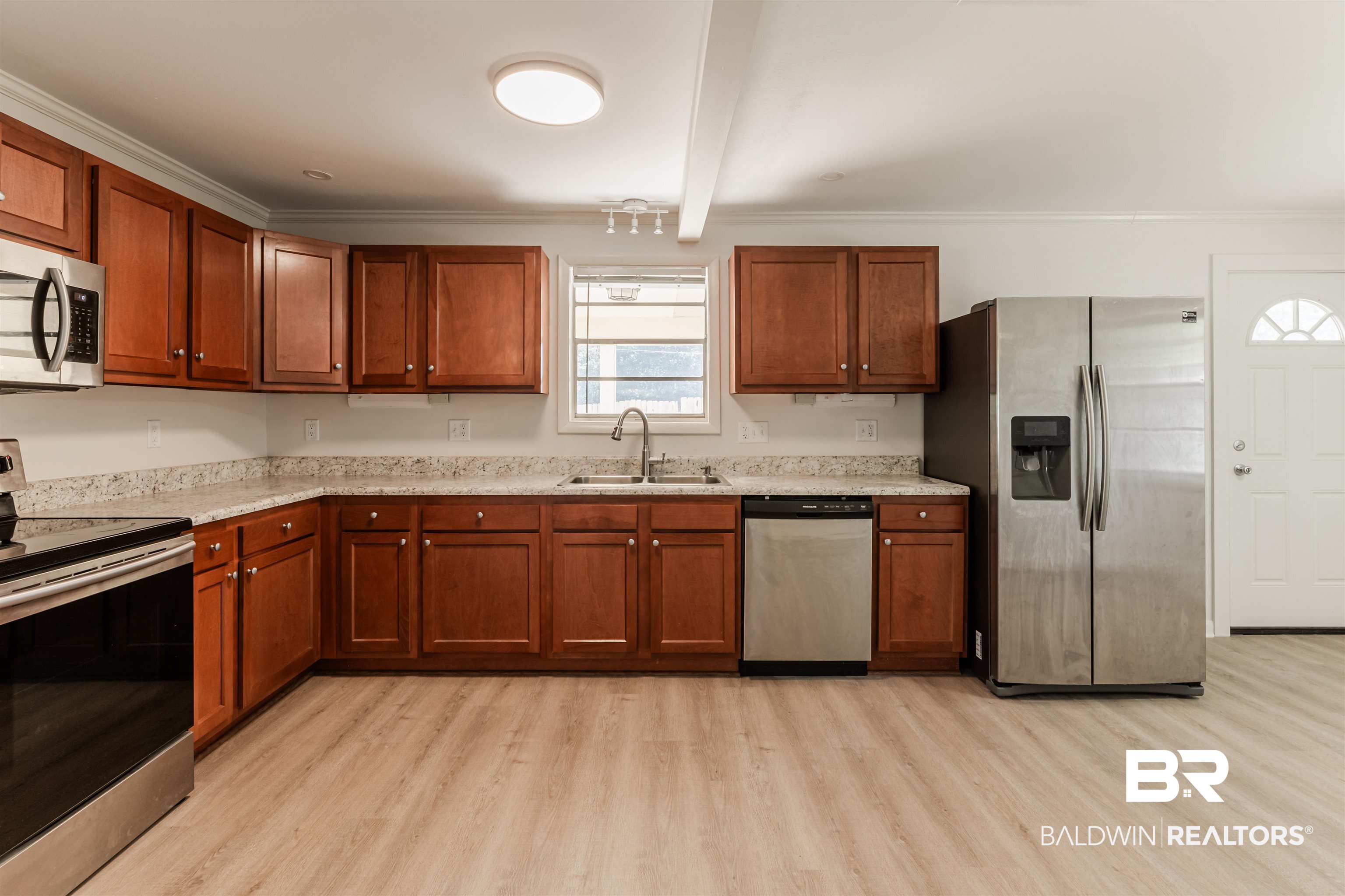 3970 Oak Ridge Avenue Mobile, AL 36619 - Photo 5 of 28 Kitchen featuring crown molding, sink, stainless steel appliances, beam ceiling, and light hardwood / wood-style flooring