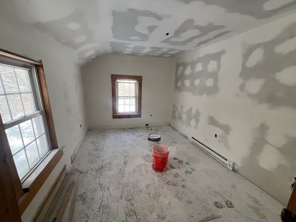 a view of a room with window and fireplace