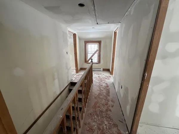 a view of a hallway with windows