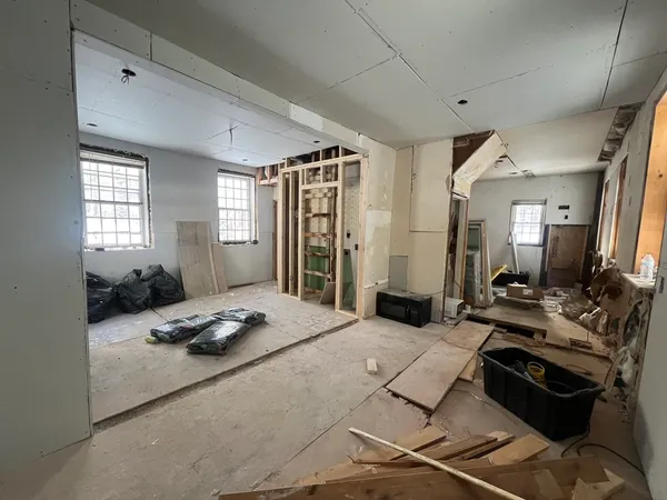 a living room with furniture and flat screen tv
