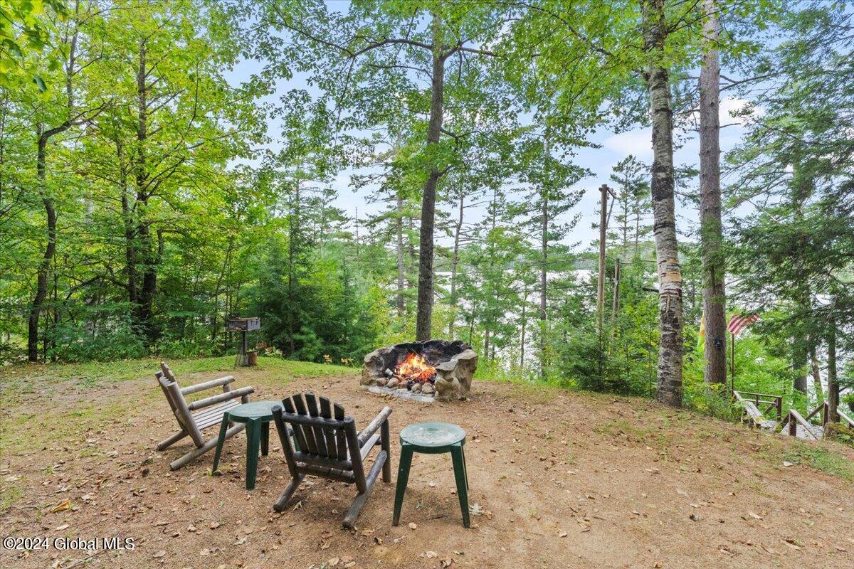 278 Fraternaland Road Paradox, NY 12858 - Photo 54 of 83 Firepit overlooking Paradox Lake