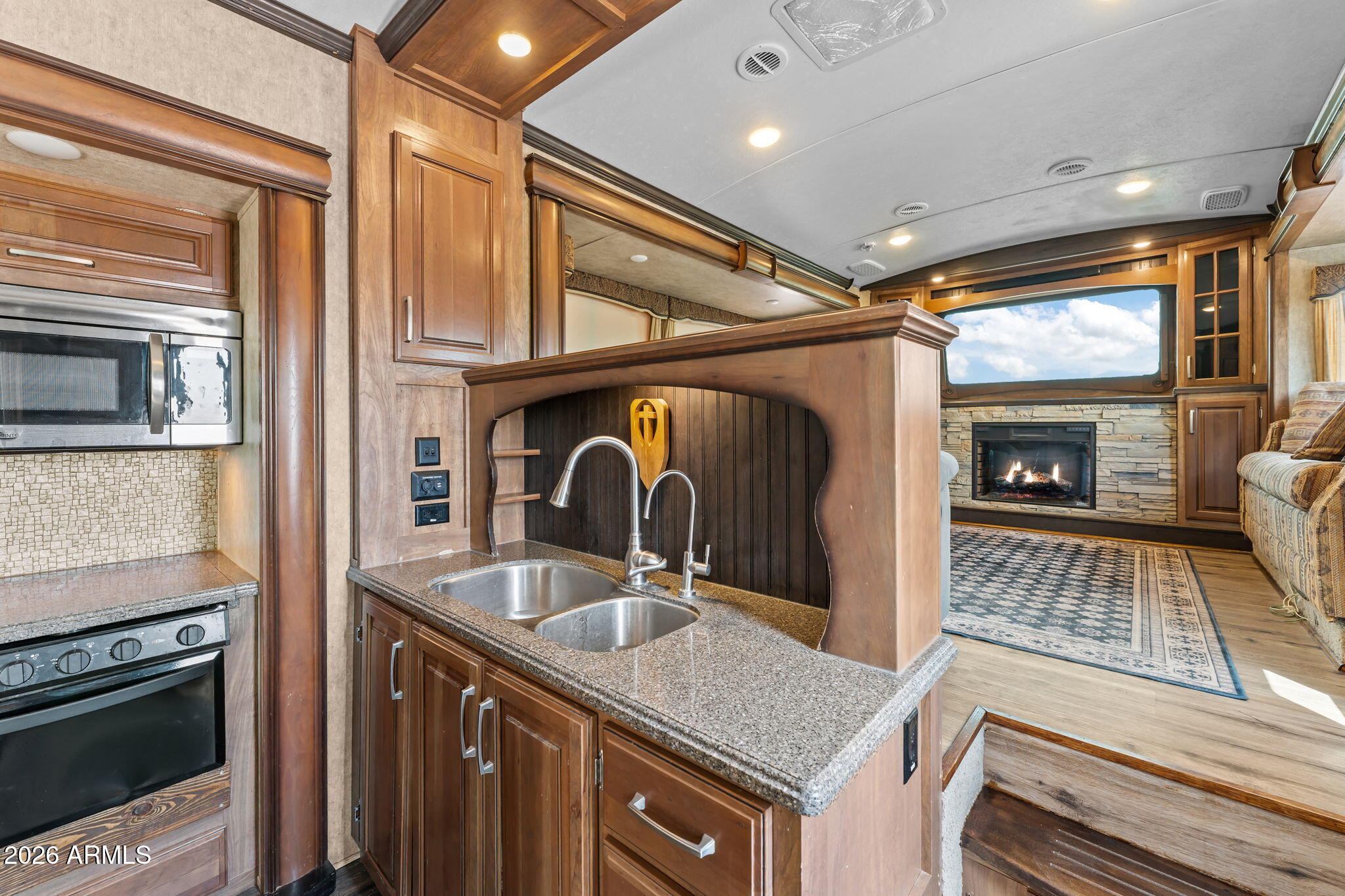 30770 South Pioneer Pass Road, Unit 393 Congress, AZ 85332 - Photo 11 of 23 a kitchen with a sink stove and microwave