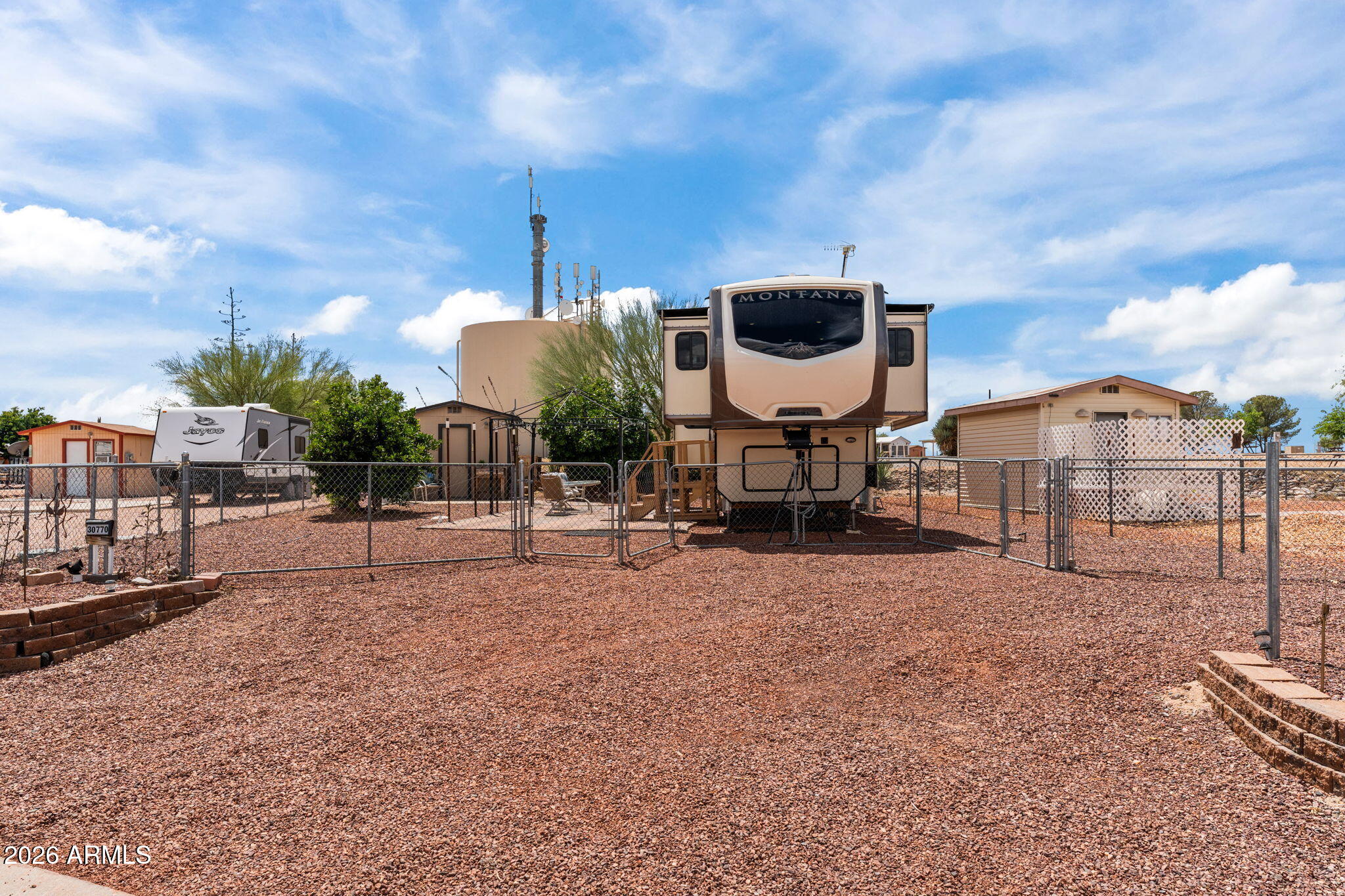 30770 South Pioneer Pass Road, Unit 393 Congress, AZ 85332 - Photo 19 of 23 a view of a house with backyard and porch