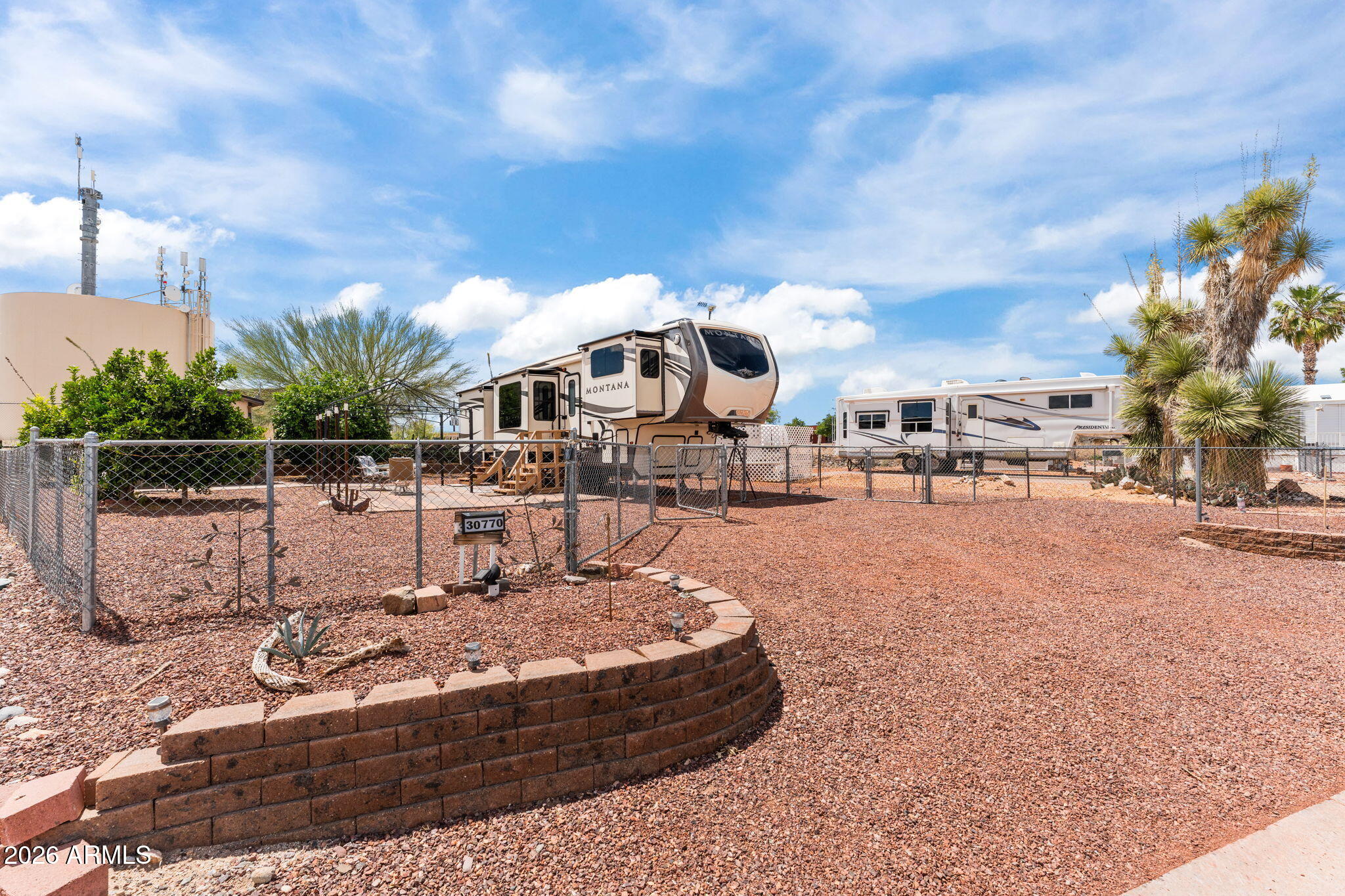 30770 South Pioneer Pass Road, Unit 393 Congress, AZ 85332 - Photo 23 of 23 a swimming pool with outdoor seating and yard