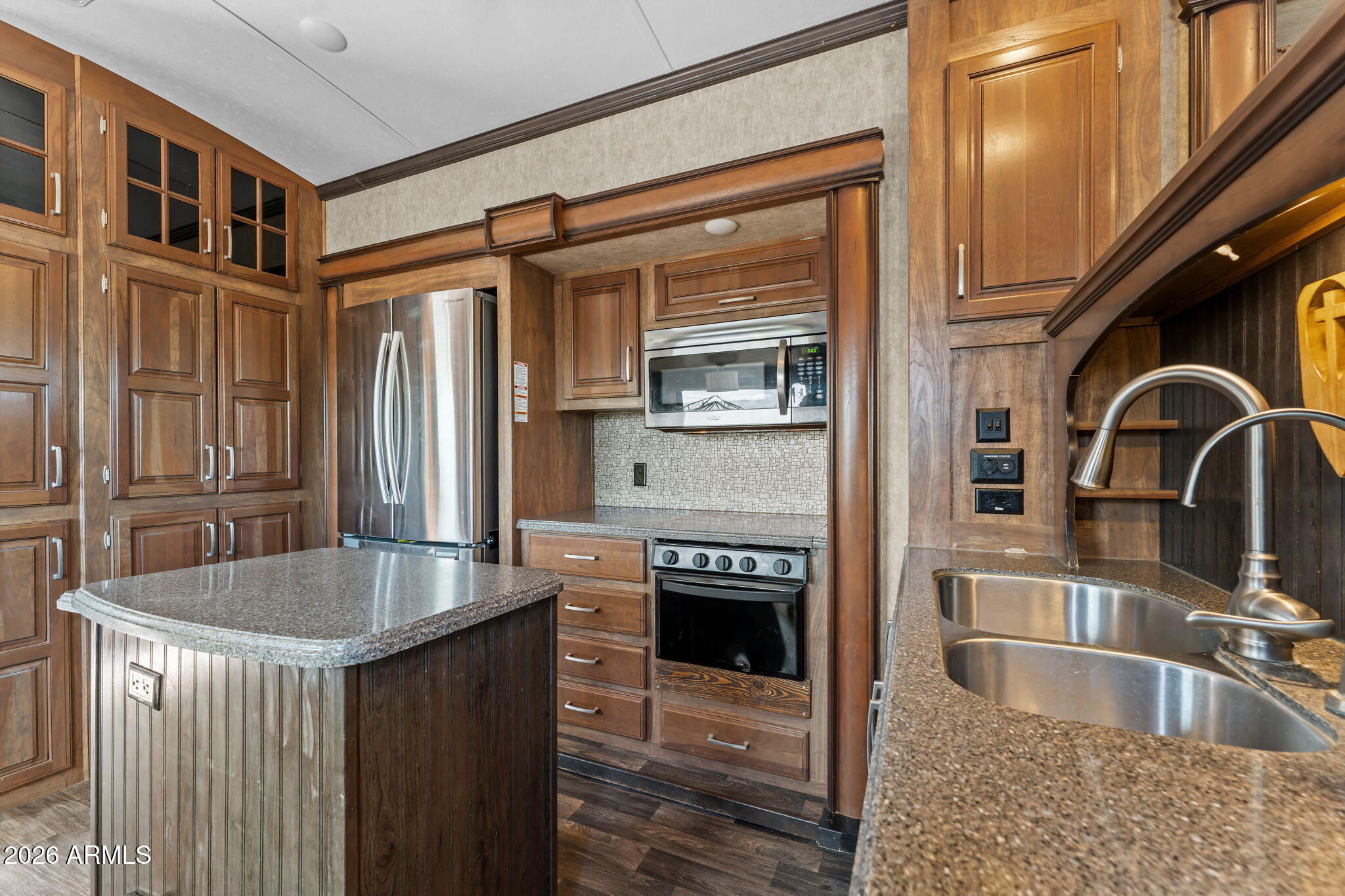 30770 South Pioneer Pass Road, Unit 393 Congress, AZ 85332 - Photo 3 of 23 a kitchen with granite countertop a sink and a refrigerator