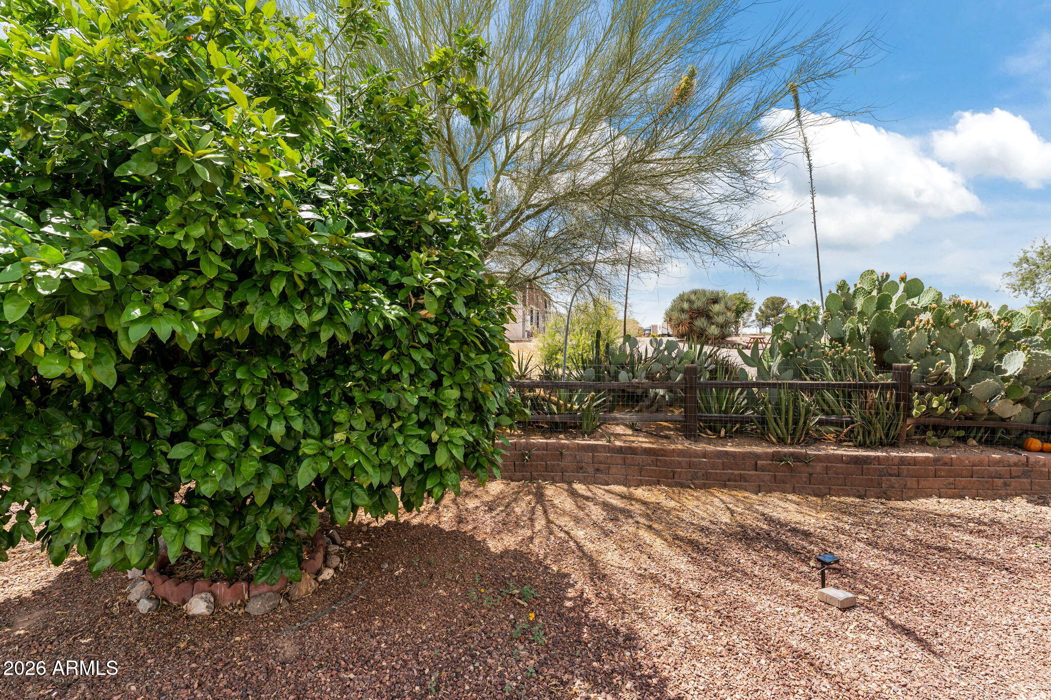 30770 South Pioneer Pass Road, Unit 393 Congress, AZ 85332 - Photo 7 of 23 a backyard of a house with lots of green space