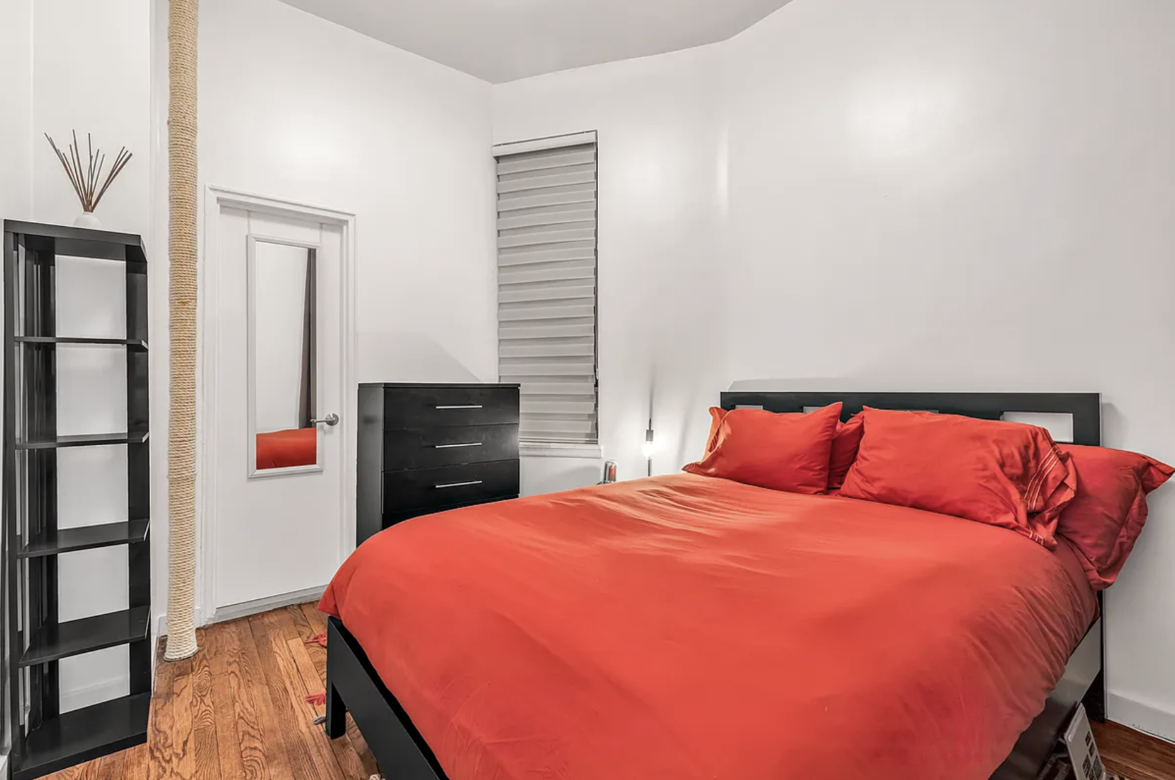 424 East 77th Street, Unit 1D Manhattan, NY 10075 - Photo 6 of 8 a bedroom with a bed and a dresser