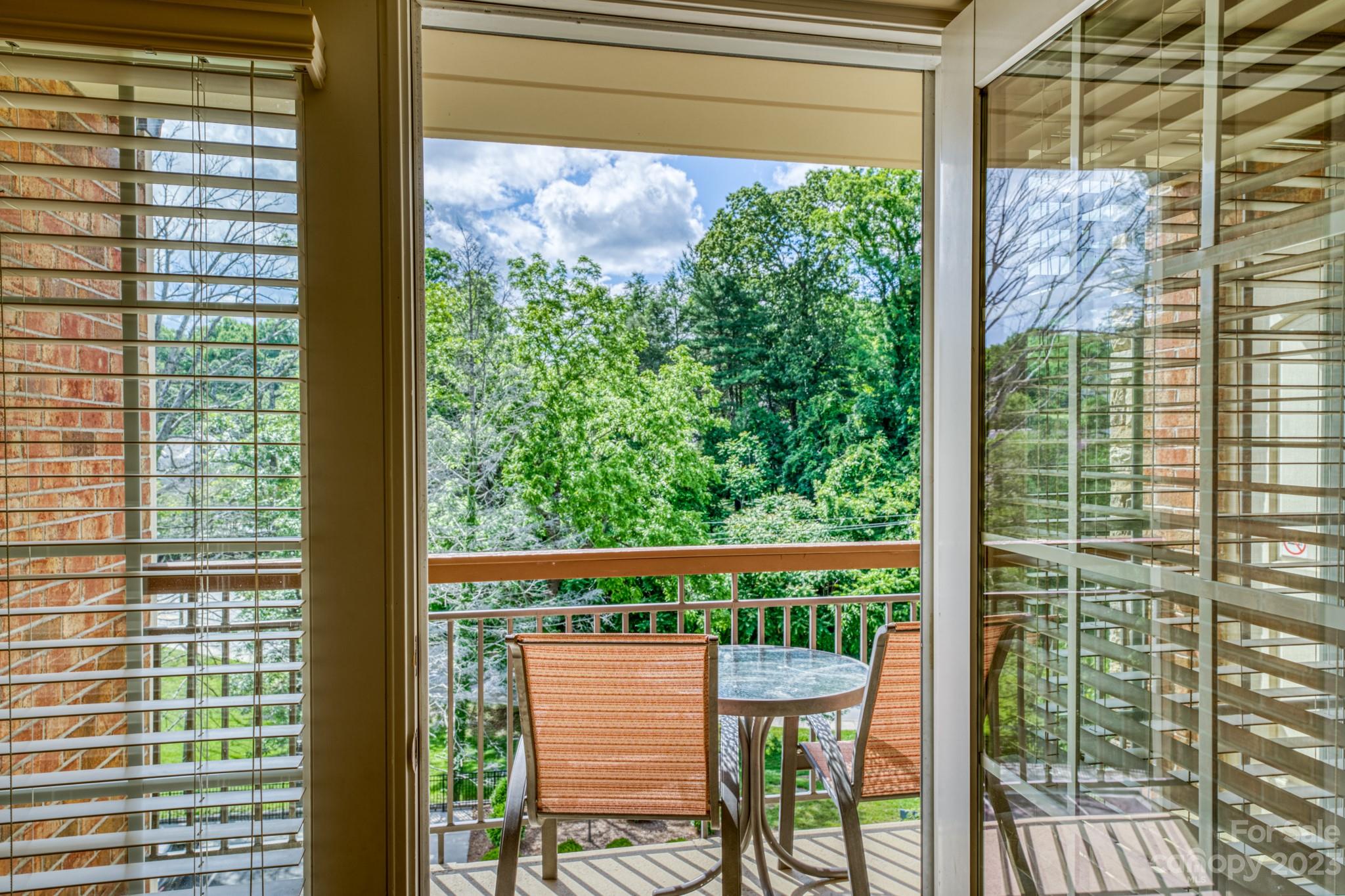 310 Bowling Park Road Asheville, NC 28803 - Photo 19 of 31 a view of a chair and table in the balcony