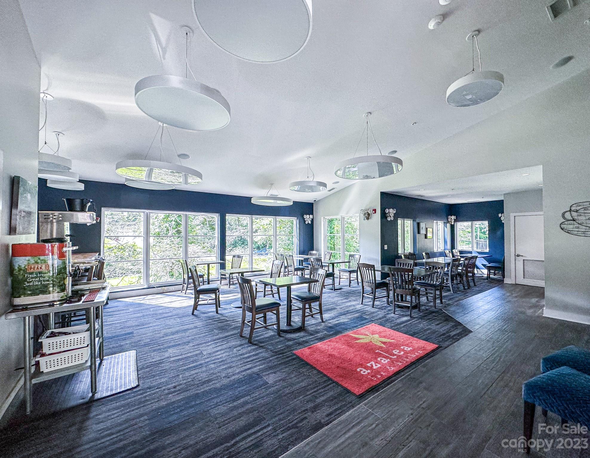 310 Bowling Park Road Asheville, NC 28803 - Photo 30 of 31 a view of a dining room with furniture window and wooden floor