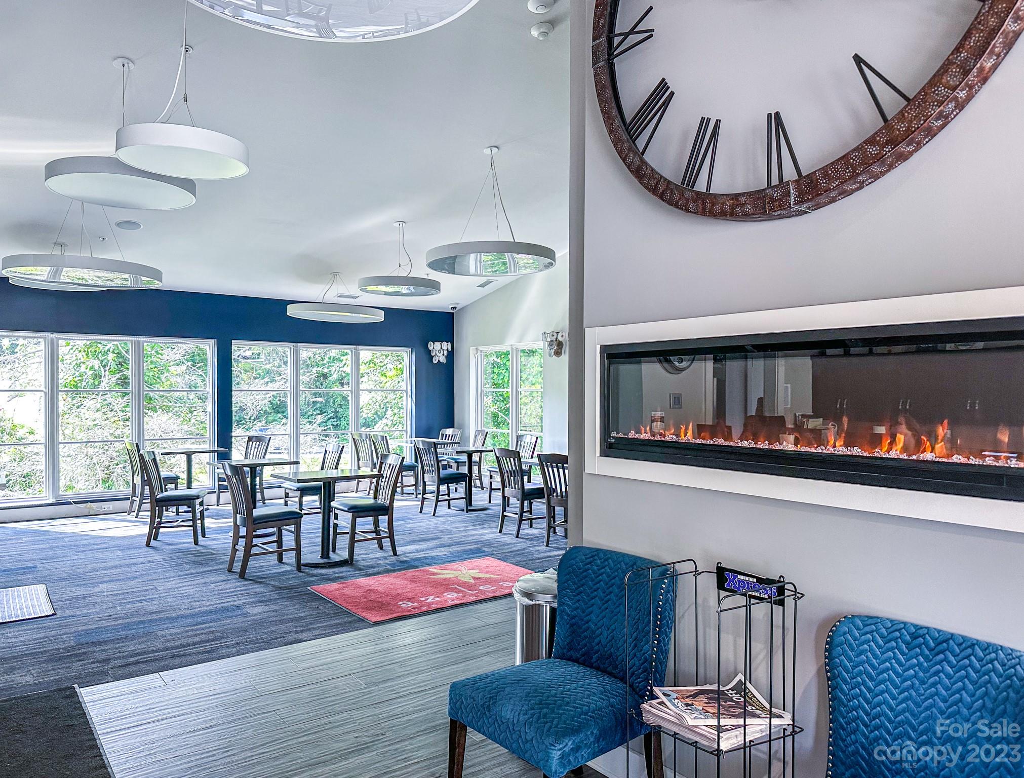 310 Bowling Park Road Asheville, NC 28803 - Photo 31 of 31 a view of a dining room with furniture window and wooden floor