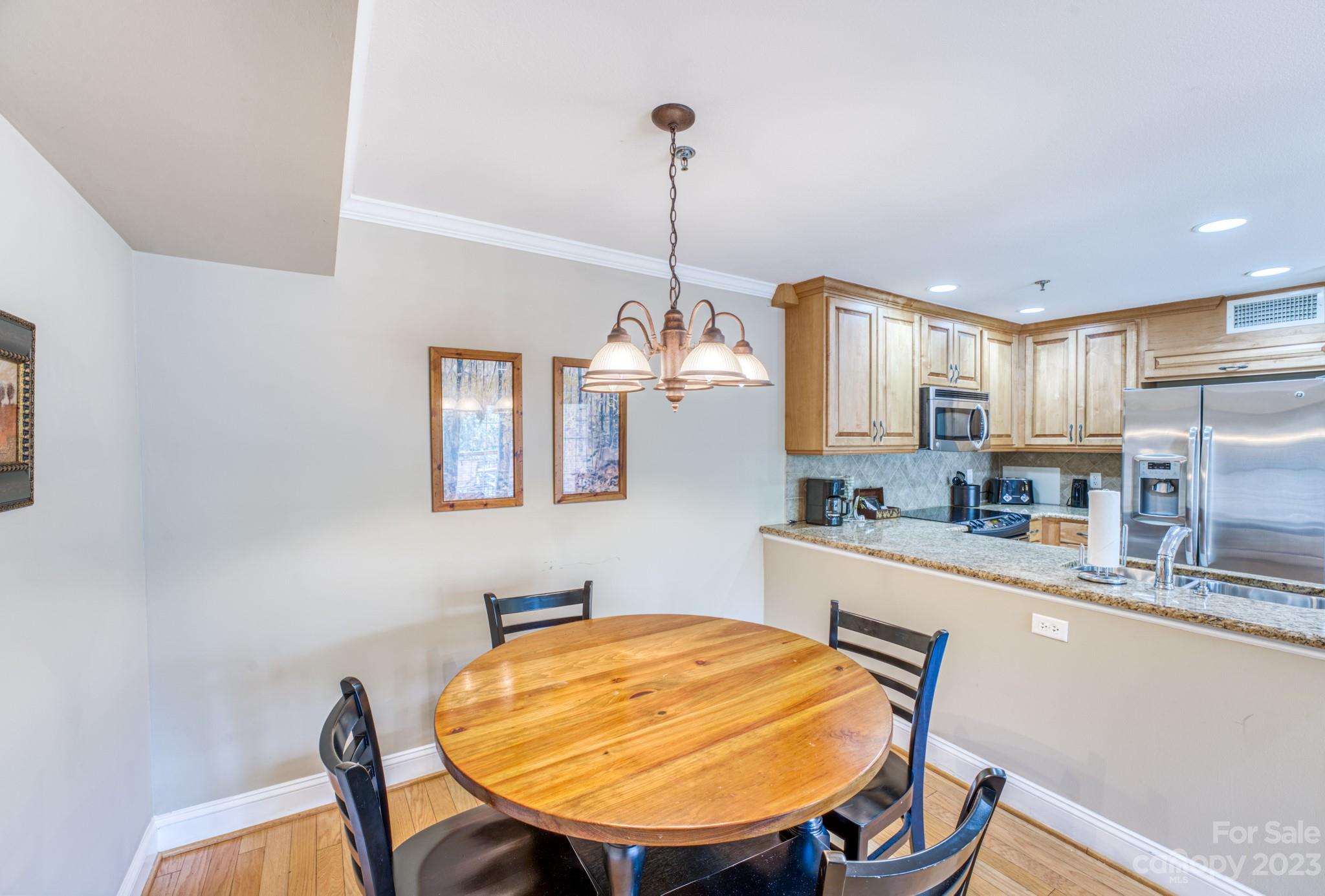310 Bowling Park Road Asheville, NC 28803 - Photo 9 of 31 a dining room with furniture and window