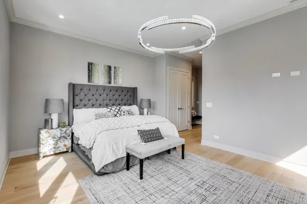 a bedroom with a bed and a mirror