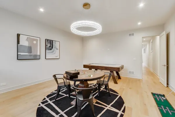 a view of a room with table and a chair