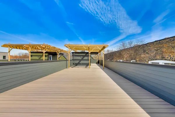 a view of a balcony with two chairs