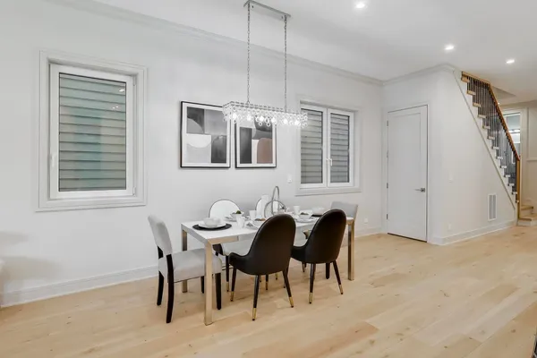 a view of a dining room with furniture and window