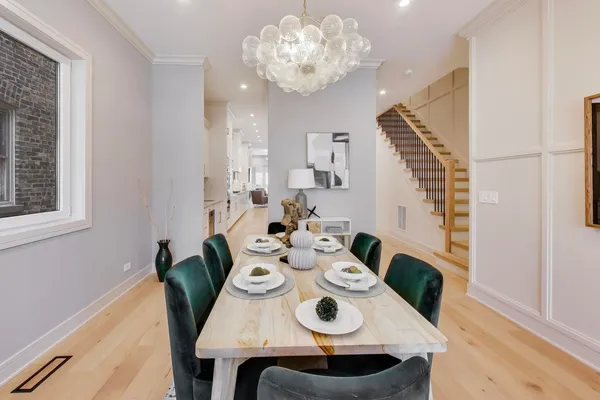 a view of a dining room with furniture and wooden floor
