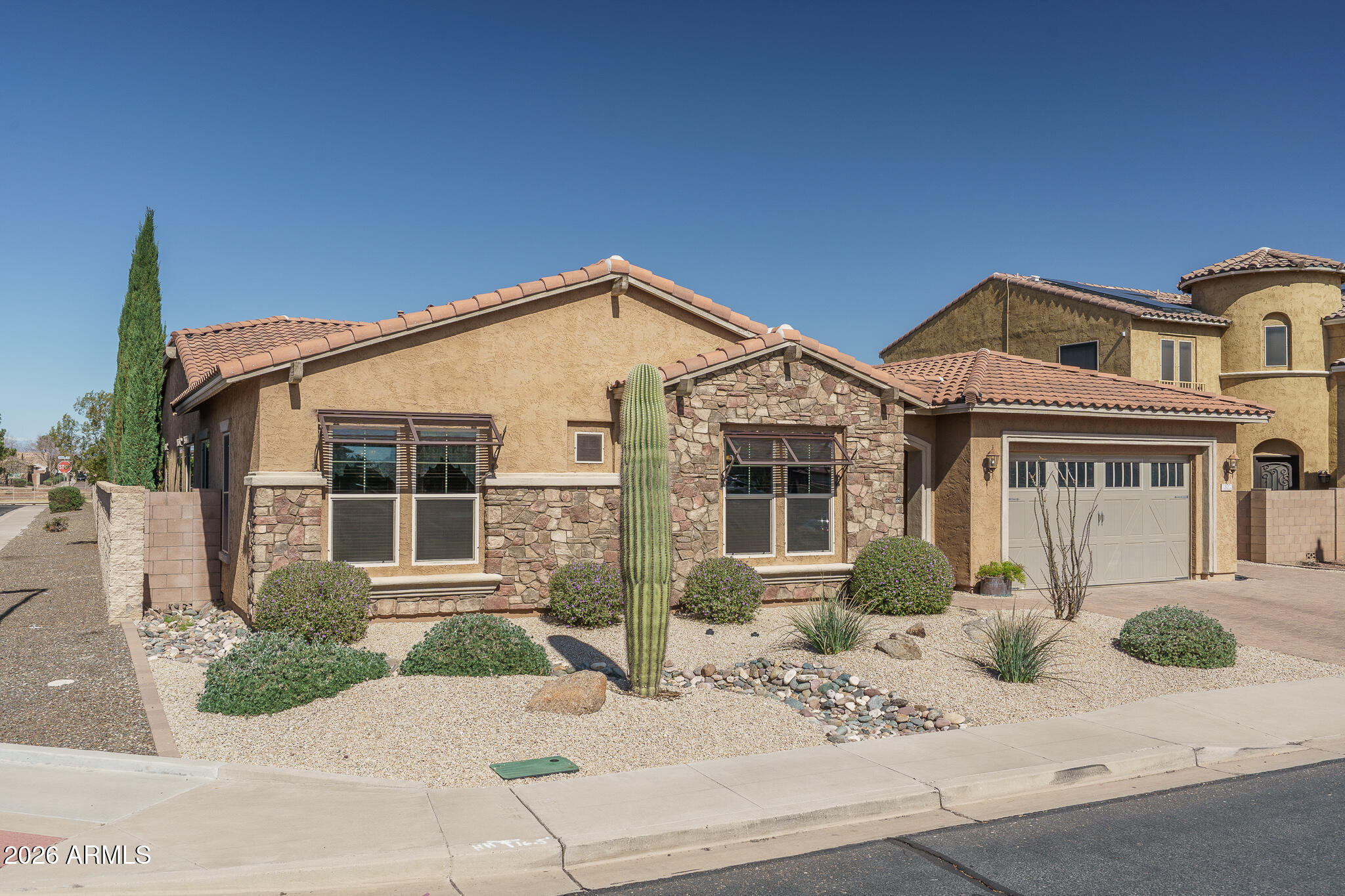 18398 West Rimrock Street Surprise, AZ 85388 - Photo 1 of 65 a front view of a house with a bench