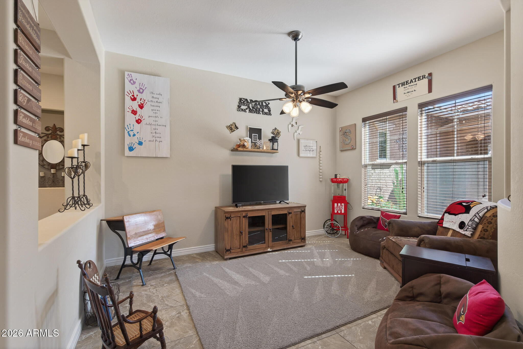 18398 West Rimrock Street Surprise, AZ 85388 - Photo 9 of 65 a living room with furniture and a flat screen tv