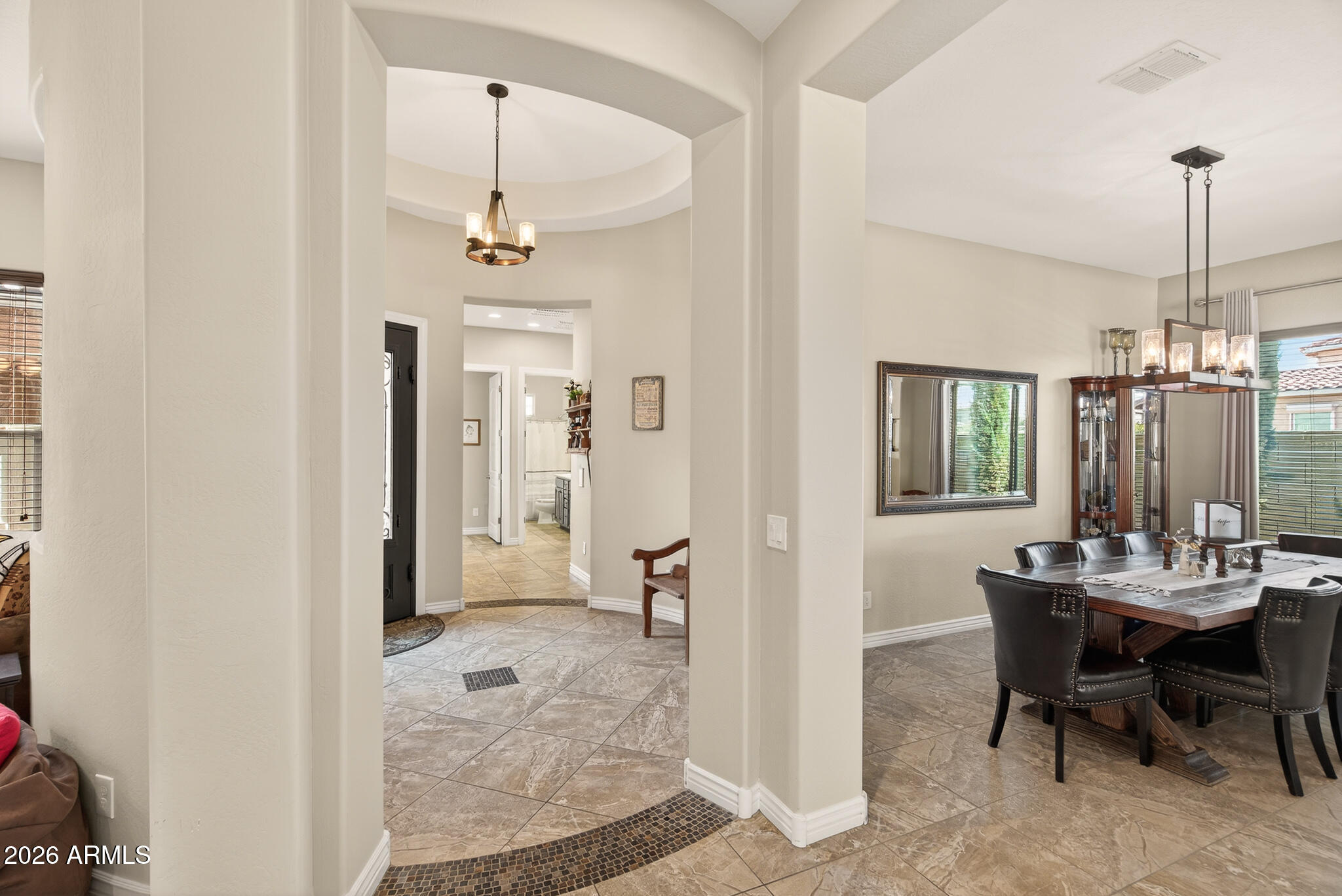 18398 West Rimrock Street Surprise, AZ 85388 - Photo 10 of 65 a view of a dining room with furniture window and wooden floor
