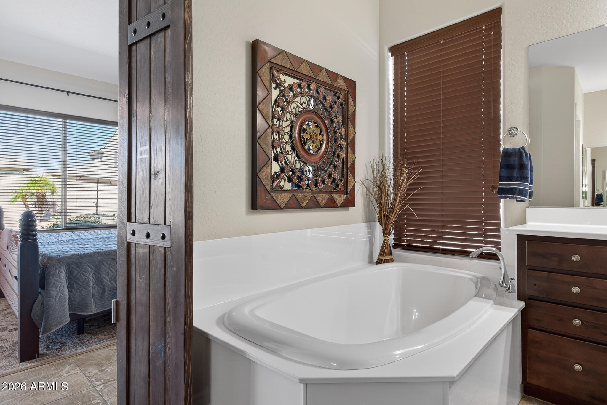 18398 West Rimrock Street Surprise, AZ 85388 - Photo 22 of 65 a bathroom with a bathtub and a shower