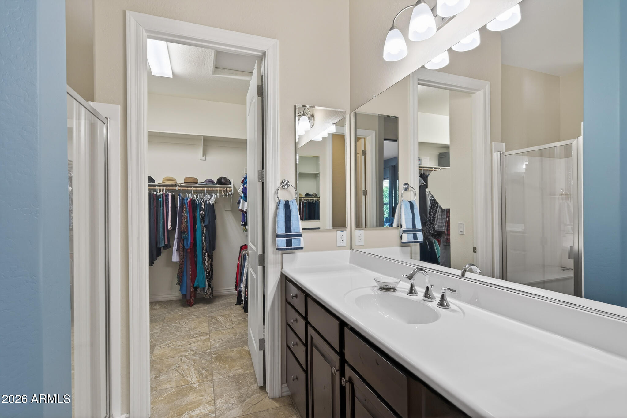18398 West Rimrock Street Surprise, AZ 85388 - Photo 24 of 65 a bathroom with a sink vanity and a mirror