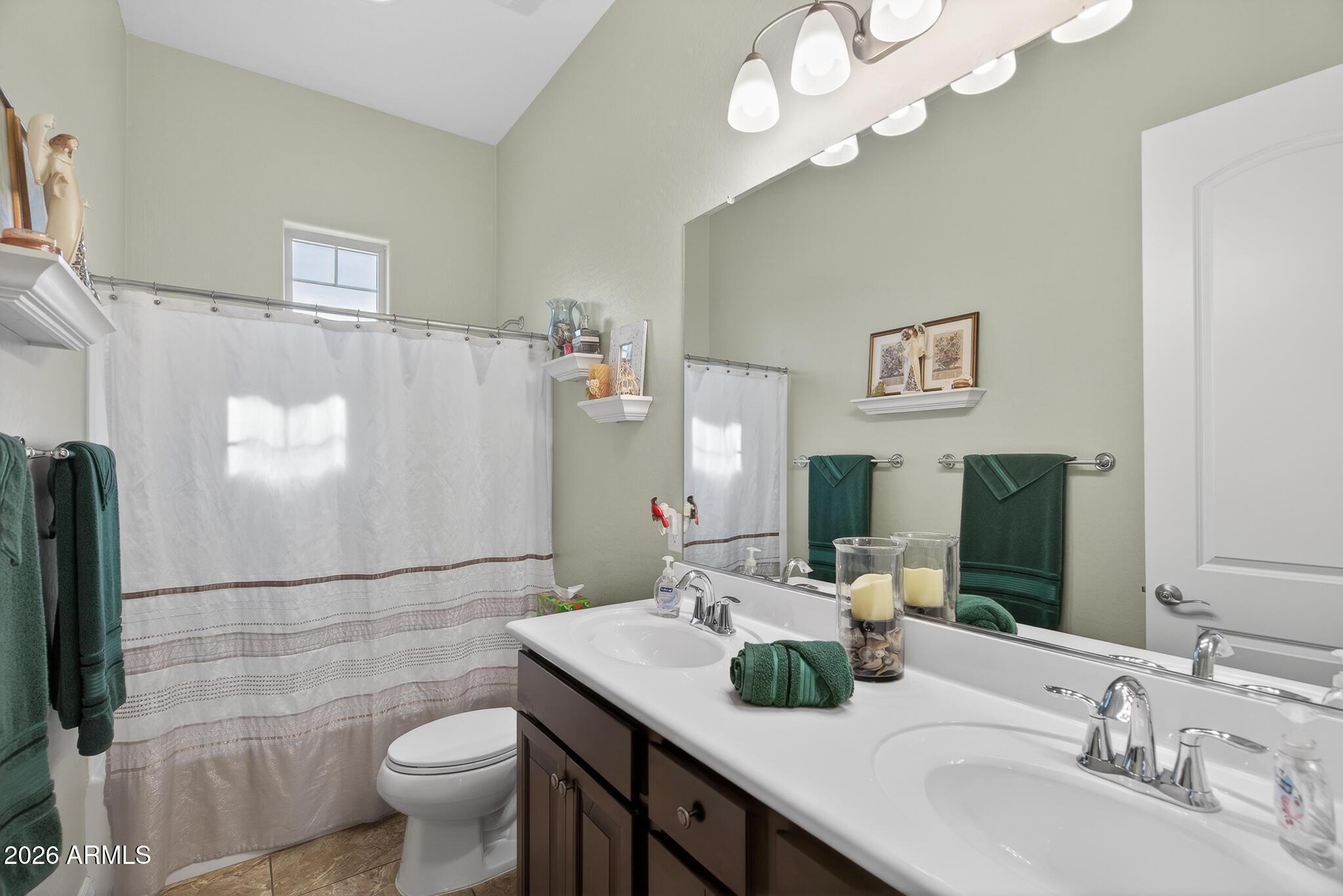 18398 West Rimrock Street Surprise, AZ 85388 - Photo 27 of 65 a bathroom with a double vanity sink mirror and toilet