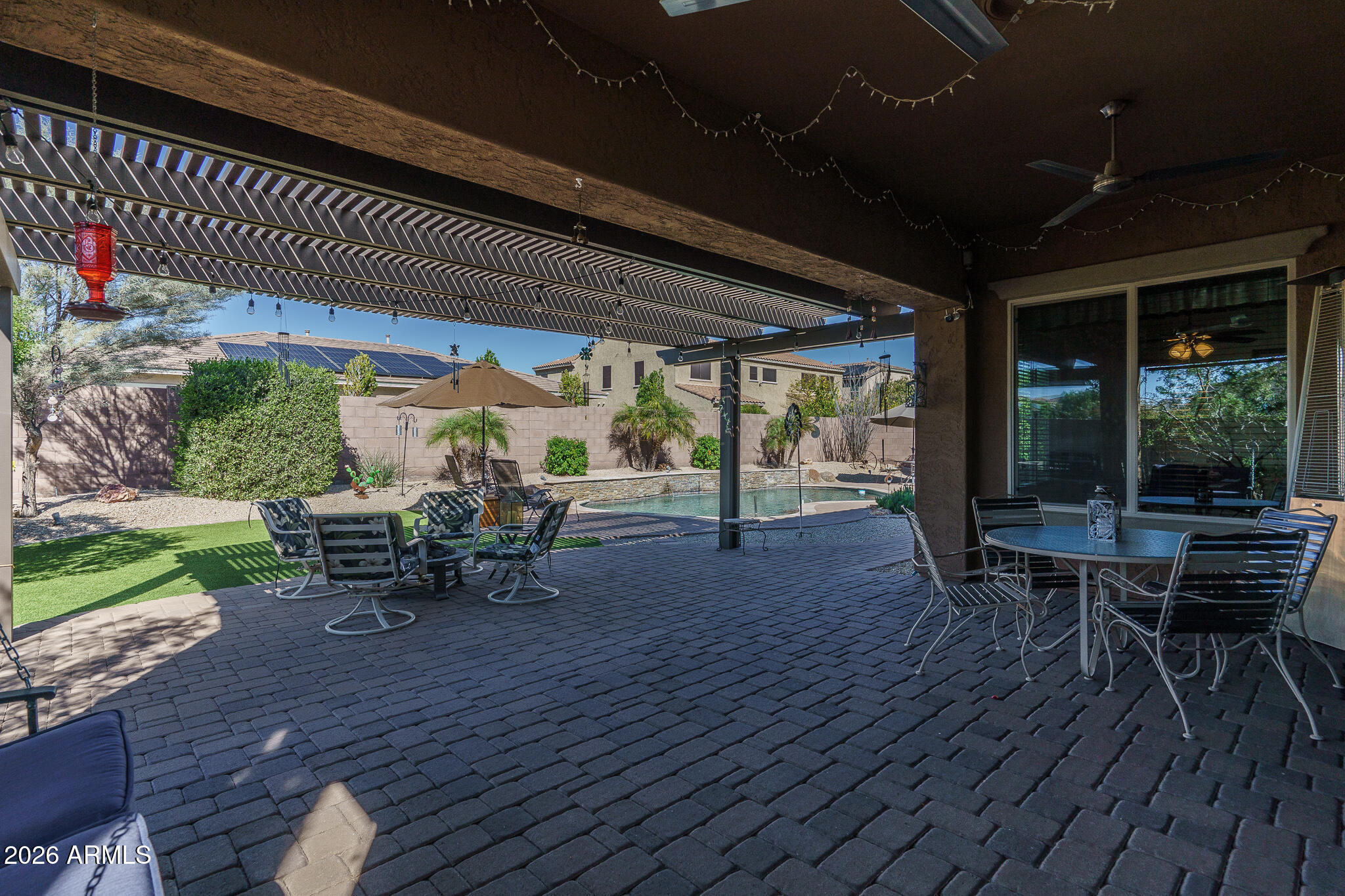 18398 West Rimrock Street Surprise, AZ 85388 - Photo 32 of 65 a view of a patio with table and chairs and potted plants