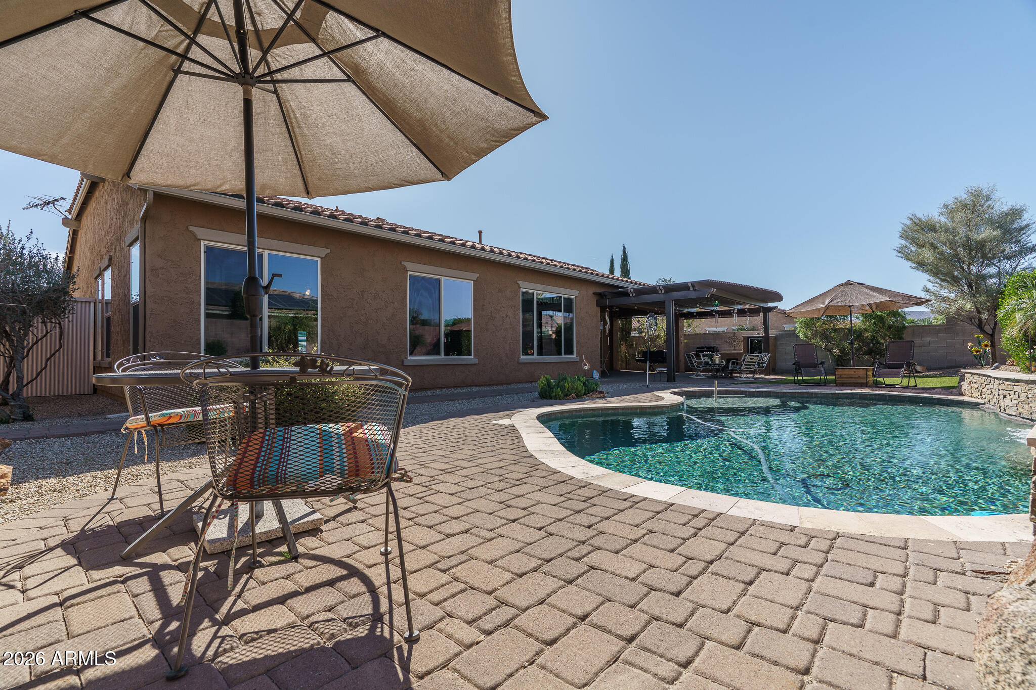 18398 West Rimrock Street Surprise, AZ 85388 - Photo 44 of 65 a view of a house with backyard porch and sitting area