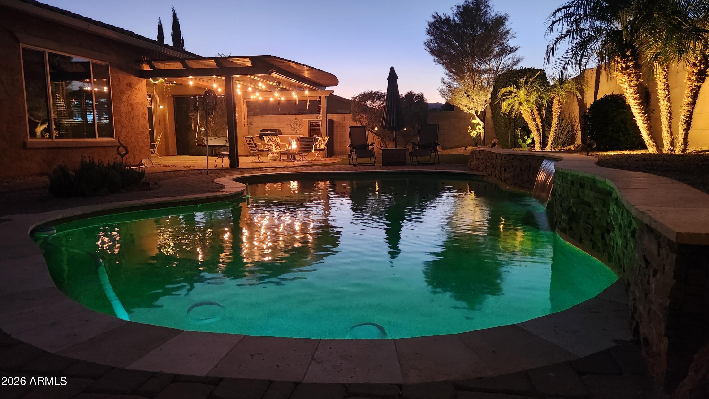 18398 West Rimrock Street Surprise, AZ 85388 - Photo 47 of 65 a view of a swimming pool with a outdoor seating