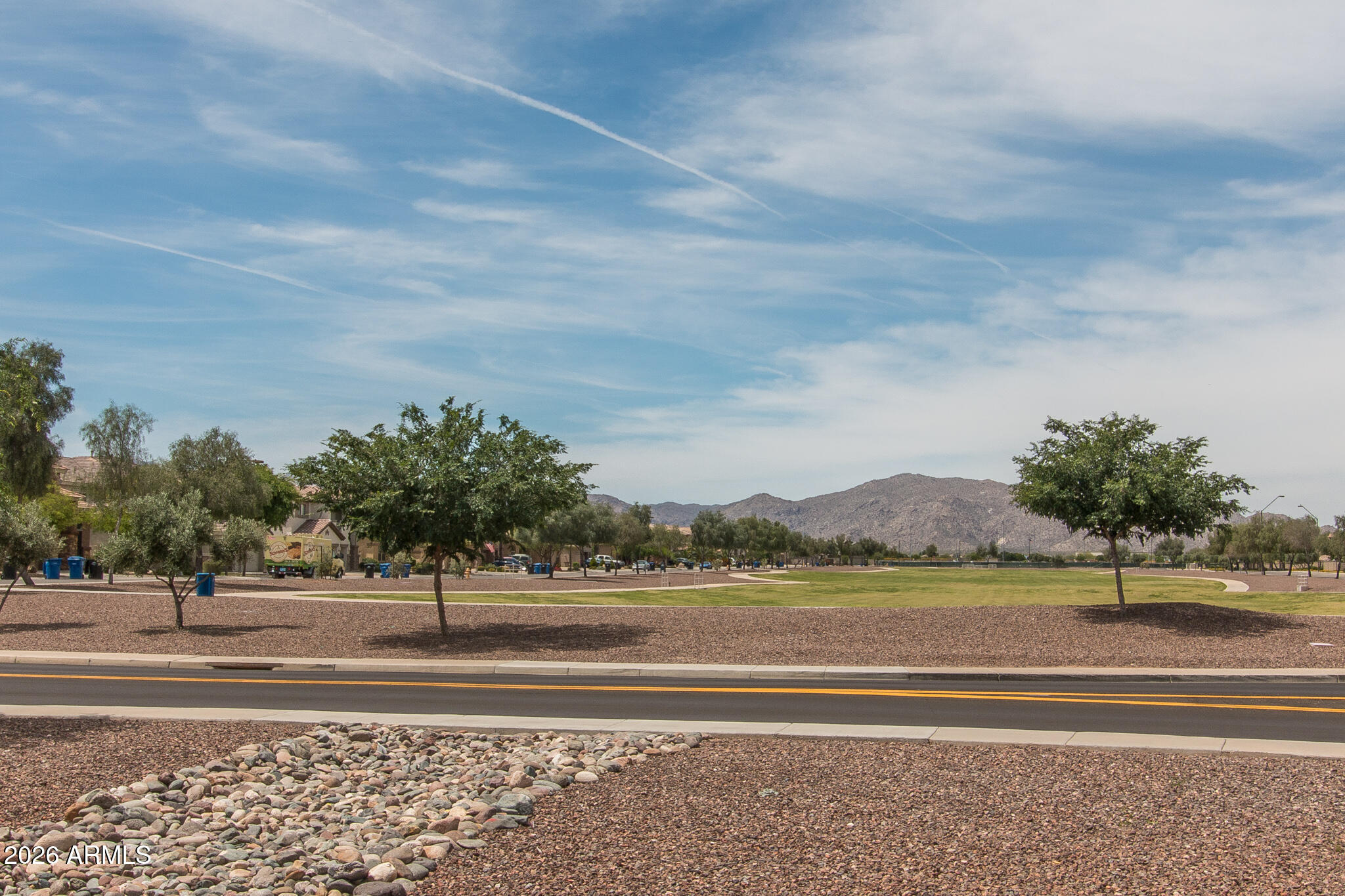 18398 West Rimrock Street Surprise, AZ 85388 - Photo 58 of 65 a view of a big yard and palm trees