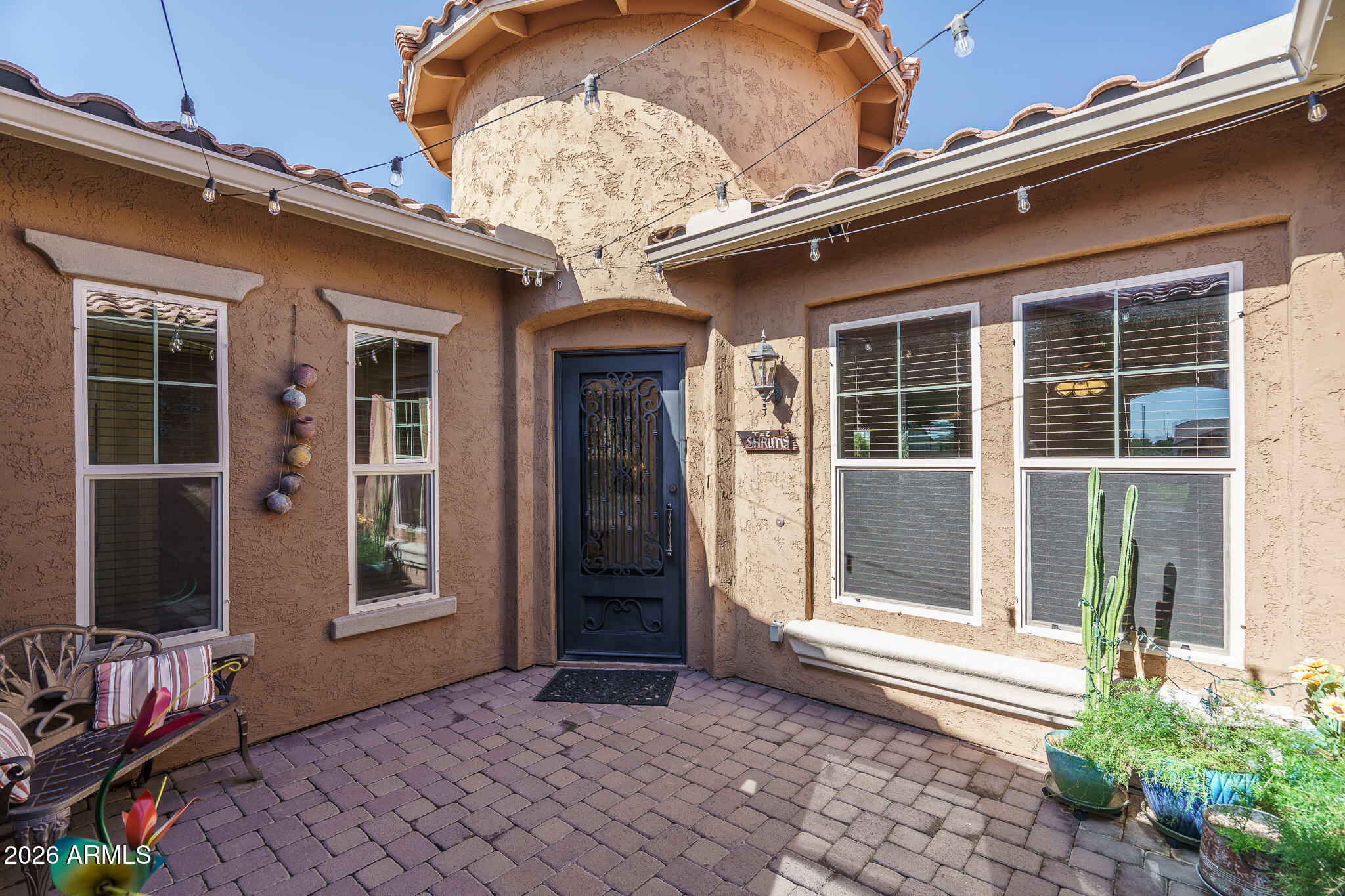 18398 West Rimrock Street Surprise, AZ 85388 - Photo 5 of 65 a front view of a house with a porch