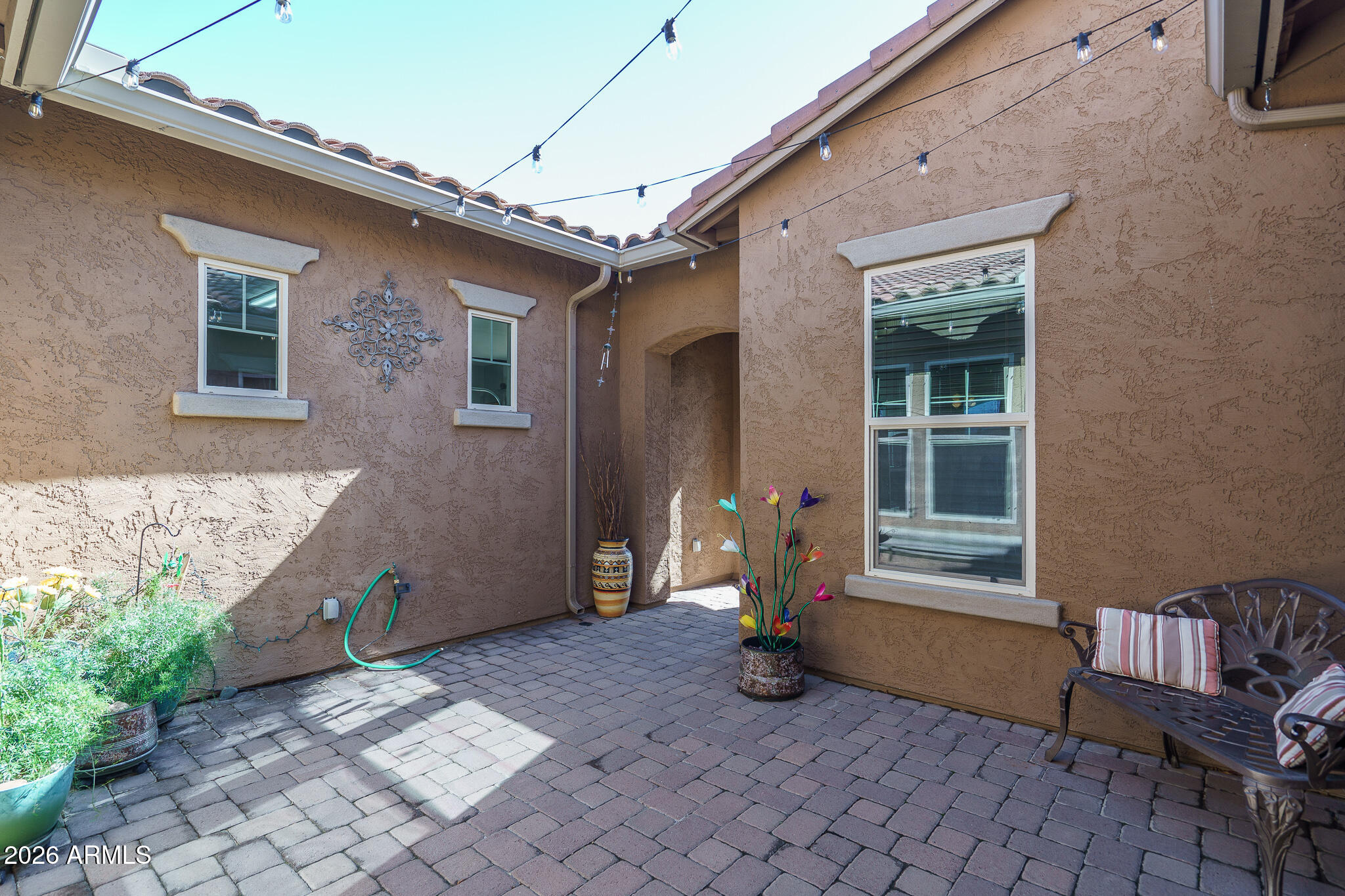 18398 West Rimrock Street Surprise, AZ 85388 - Photo 6 of 65 a backyard of a house with outdoor seating