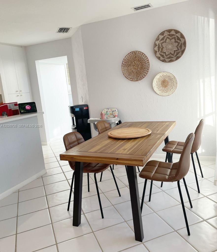 17244 Balboa Point Way Boca Raton, FL 33487 - Photo 31 of 66 a view of a dining room with furniture and wooden floor