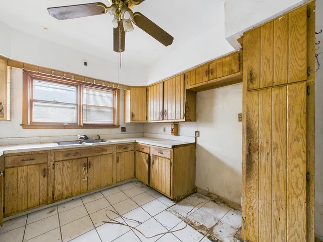 a large bathroom with a double vanity sink a mirror and a bathtub