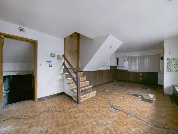 a view of a livingroom with furniture and a fireplace