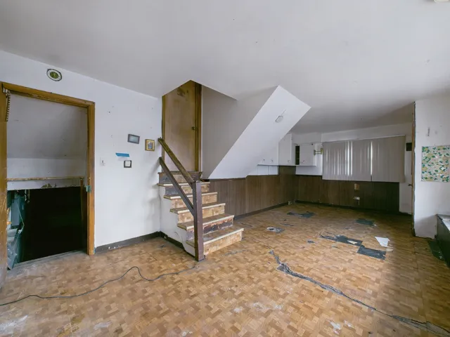 a view of a livingroom with furniture and a fireplace