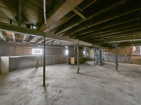 a view of empty room with wooden walls