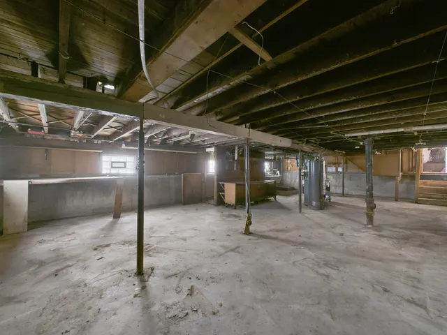 a view of empty room with wooden walls