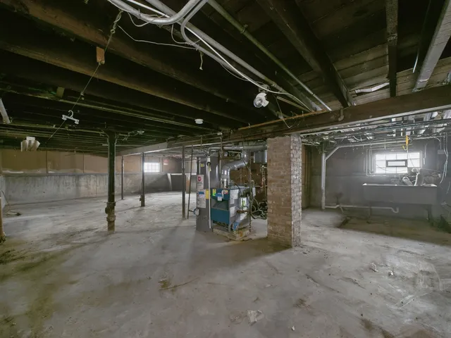 a view of a house with a yard and a garage