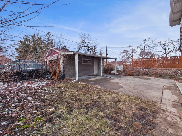 a view of a house with a backyard