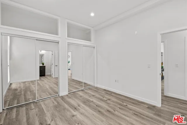wooden floor with white walls