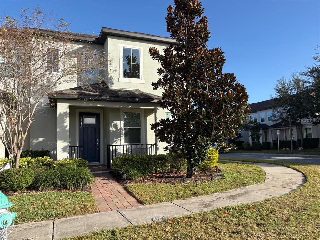 a front view of a house with garden