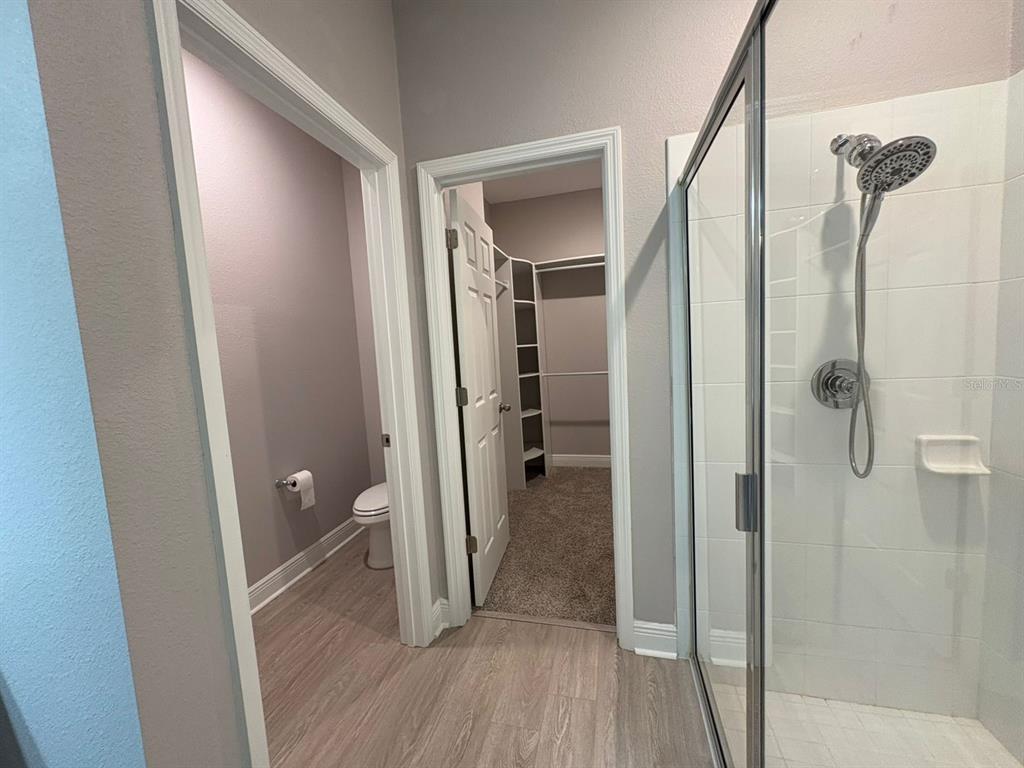 9640 Amber Chestnut Way Winter Garden, FL 34787 - Photo 12 of 32 a view of a bathroom from a hallway